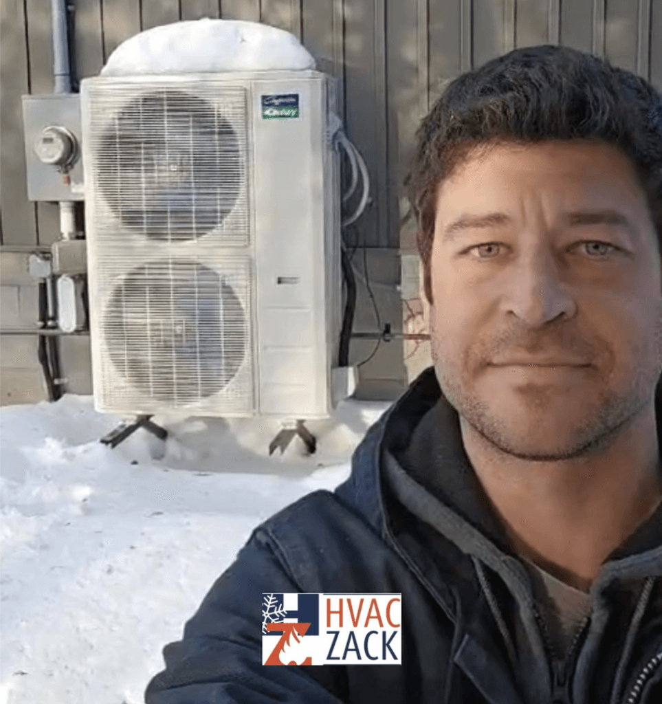 HVAC Zack in front of a recent heat pump installation in the Durham region.
