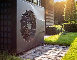 Heat pump outside a home that once had oil heating.