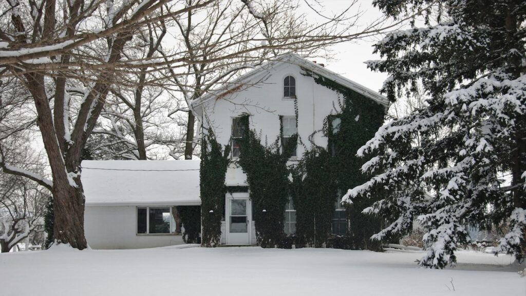 Snow-covered Durham Region home in winter, showing why a hybrid heat pump and furnace system is ideal for extreme cold weather