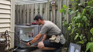 HVAC Zack installing a new air conditioning unit at a home in Oshawa