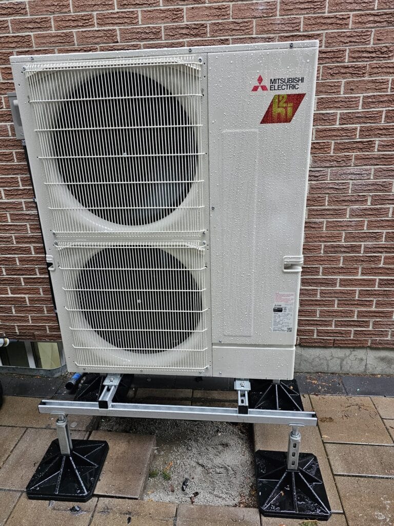Outdoor heat pump unit in winter conditions in Durham Region