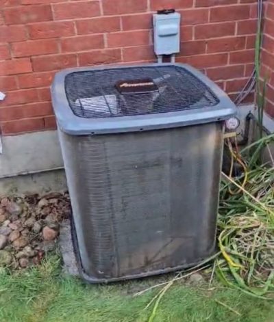 AC Cleaning and Tune-Up in Bowmanville | HVAC Zack Technician washing outdoor air conditioner coil in Bowmanville