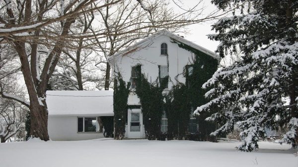 Snow-covered Durham Region home in winter, showing why a hybrid heat pump and furnace system is ideal for extreme cold weather