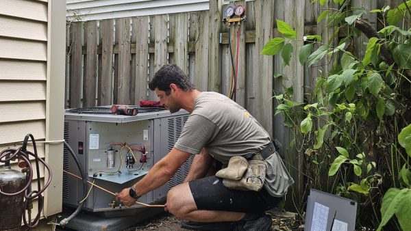 HVAC Zack installing a new air conditioning unit at a home in Oshawa